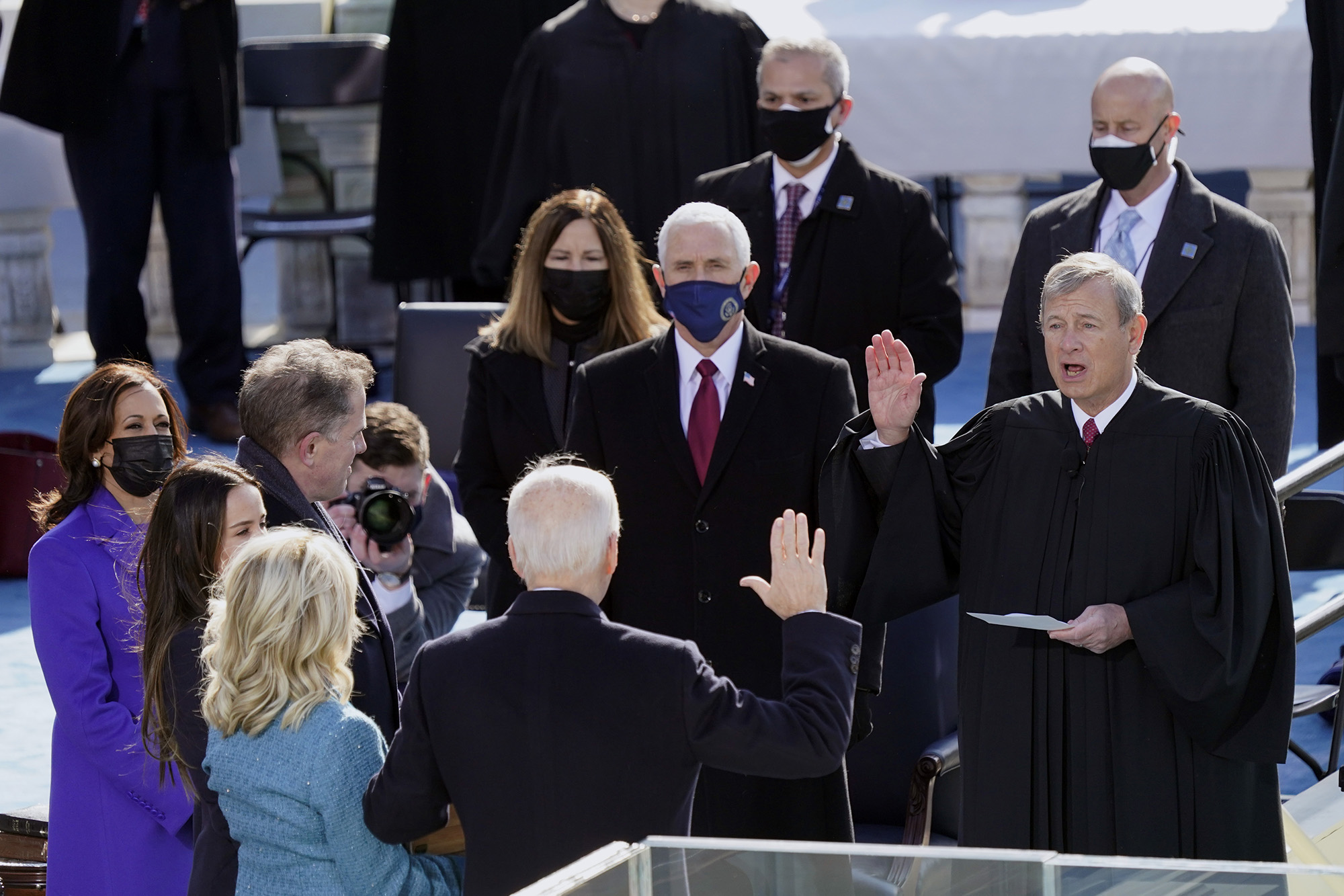 Joe Biden is sworn in as the 46th president of the United States by Chief Justice John Roberts as Jill Biden holds the Bible during the 59th Presidential Inauguration at the U.S. Capitol in Washington, Wednesday, Jan. 20, 2021.